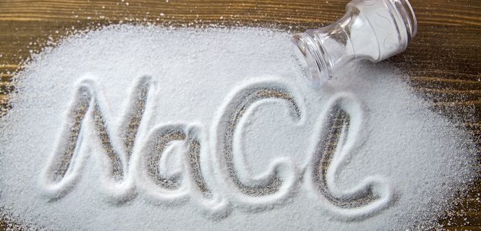 NaCl written on a heap of salt - Sodium Chloride