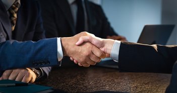 People,Shaking,Hands,In,A,Dark,Room.,Corruption.,Collusion.