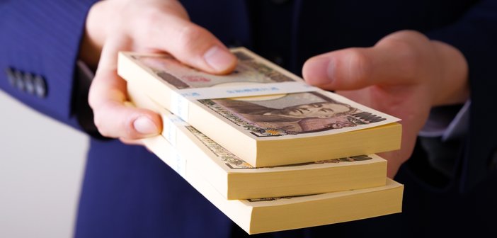 A,Man,In,A,Suit,With,A,Lot,Of,Money