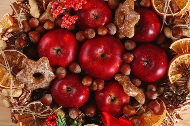 Christmas apples, nuts and cookies close-up