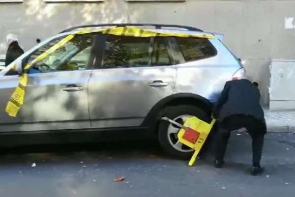 駐車禁止　拘束具　爺さん