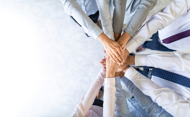 Close,Up,Top,View,Of,Young,Business,People,Putting,Their