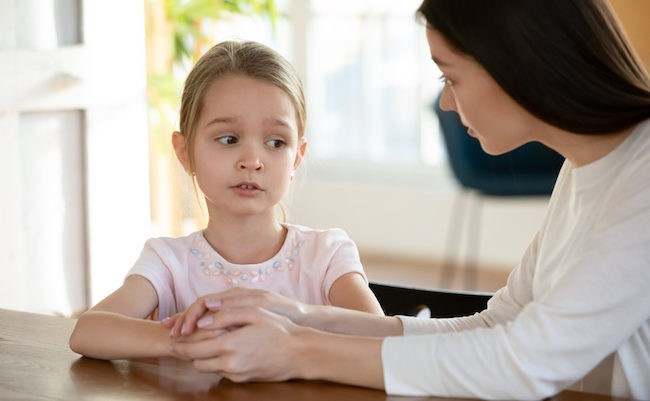 Head,Shot,Unhappy,Small,Child,Girl,Sitting,At,Table,With