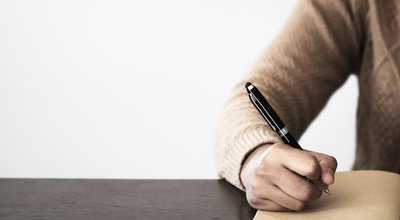 Close,Up,Of,Hand,Holding,Pen,,It's,Like,A,Letter