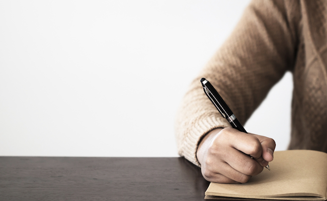 Close,Up,Of,Hand,Holding,Pen,,It's,Like,A,Letter