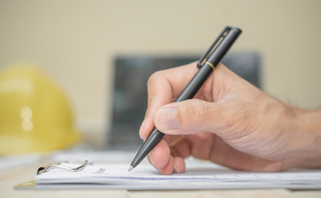 Hand,Hold,Pen,Writing,On,Document