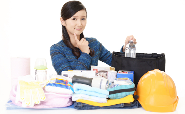 Woman,With,Disaster,Prevention,Goods