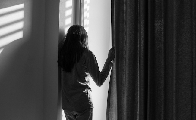 Lonely,Woman,With,Beautiful,Light,In,Room