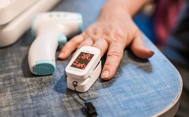 Pulse,Oximeter,Is,Placed,On,Index,Finger,Of,Woman,S