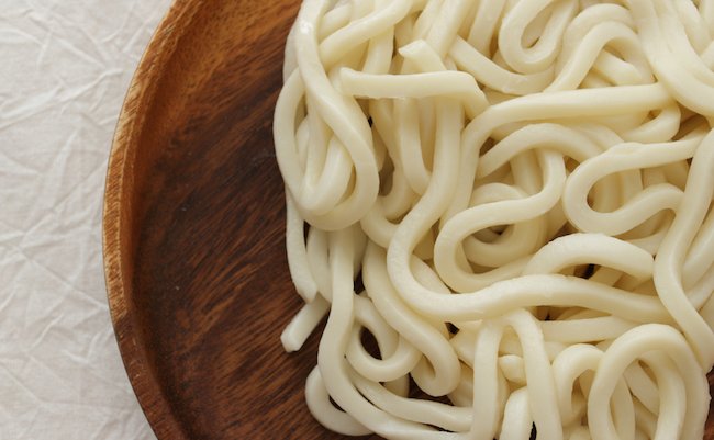 Japanese food ingredient, Udon noodles on wooden plate