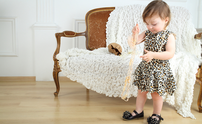 Beautiful,Little,Girl,In,Leopard,Print,Dress,With,Beads,Stands