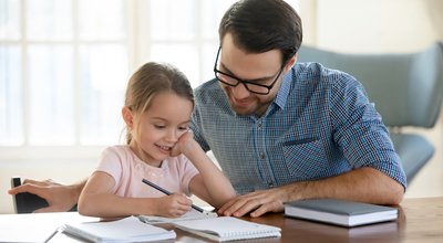 Young,Father,In,Eyeglasses,Pleased,To,See,Little,Daughters',Study