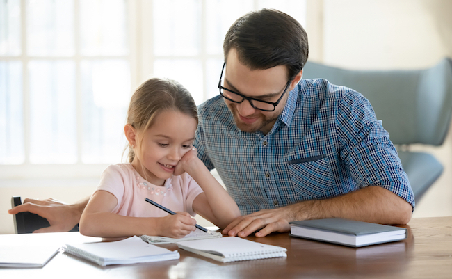 Young,Father,In,Eyeglasses,Pleased,To,See,Little,Daughters’,Study