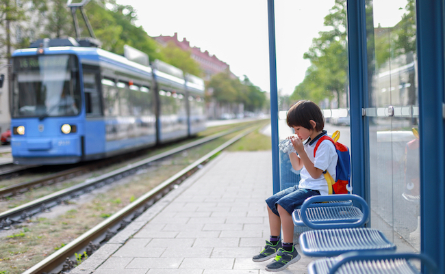 Little,Backpack,Boy,Eating,Food,At,Cable,Car,Station,Alone