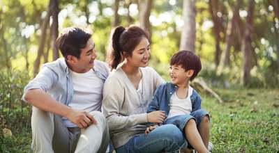 Young,Asian,Parents,And,Son,Having,Fun,Outdoors,In,Park