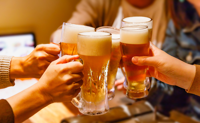 Hands,And,Mug,Beer,Of,Many,People,Toasting,At,A