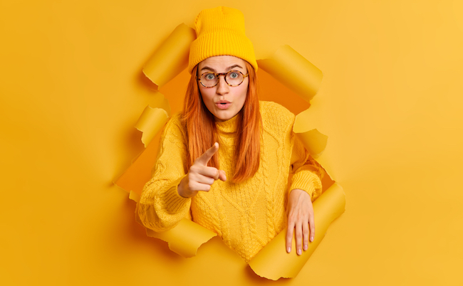 Astonished,Redhead,Woman,Points,At,Camera,With,Surprised,Expression,Picks