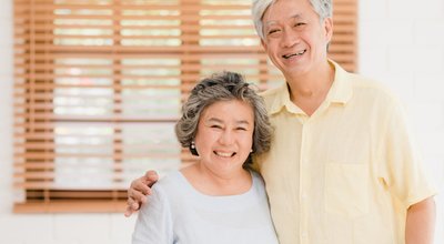 Asian,Elderly,Couple,Feeling,Happy,Smiling,And,Looking,To,Camera