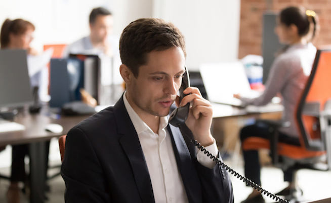 Serious,Company,Employee,Male,In,Formal,Suit,Sitting,In,Shared