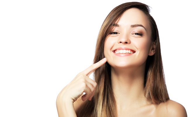 Picture,Of,Beautiful,Woman,Pointing,To,Teeth