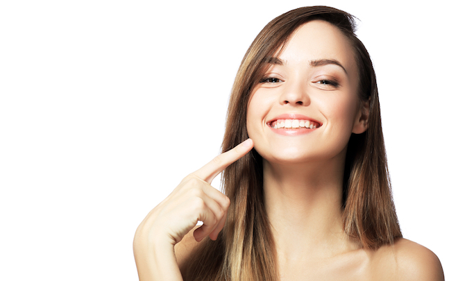 Picture,Of,Beautiful,Woman,Pointing,To,Teeth