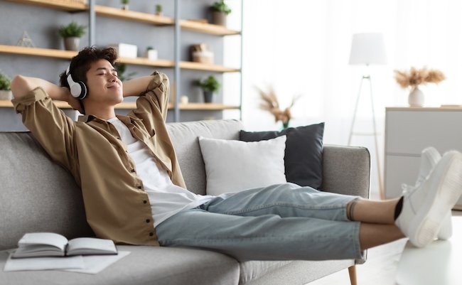 Rest,And,Relax,Concept.,Calm,Asian,Man,Sitting,On,Couch,