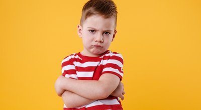 Portrait,Of,A,Frowning,Upset,Little,Boy,Looking,At,Camera