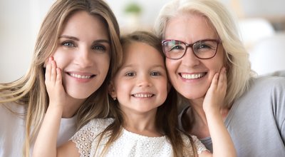 Portrait,Of,Three,Generations,Of,Women,Look,At,Camera,Posing