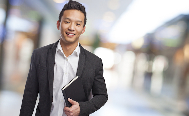 Young,Asian,Business,Man,Holding,A,Book