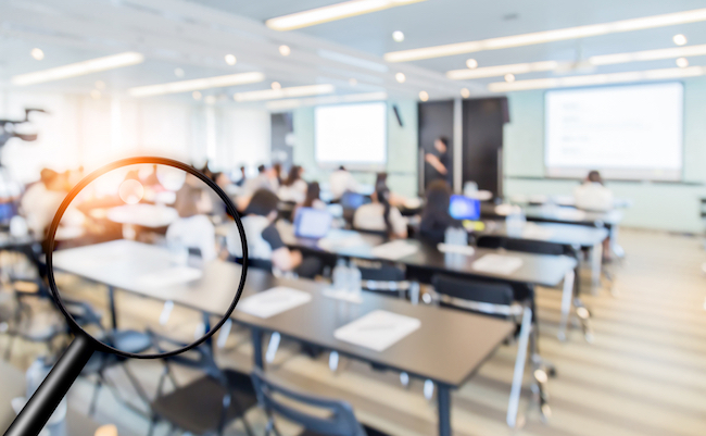 Blur,Image,Background,Of,Classroom,With,Black,Magnifying,Glass