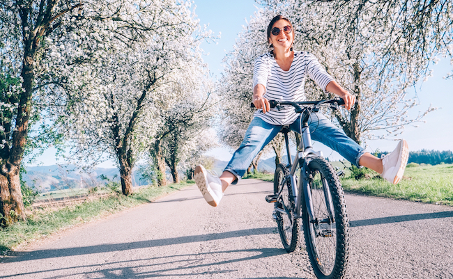 Happy,Smiling,Woman,Cheerfully,Spreads,Legs,On,Bicycle,On,The