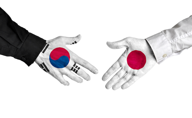 South,Korea,And,Japan,Leaders,Shaking,Hands,On,A,Deal