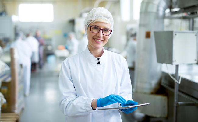 Young,Joyful,Beautiful,Female,Worker,In,Sterile,Cloths,Holding,A