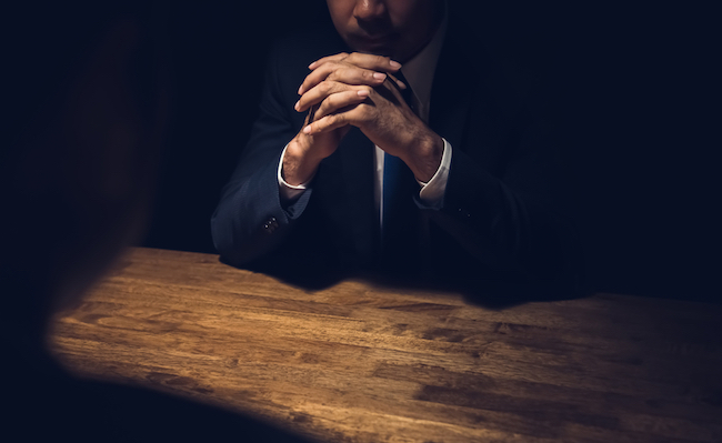 Detective,Interviewing,Suspect,In,Dark,Private,Room,-,Investigation,And