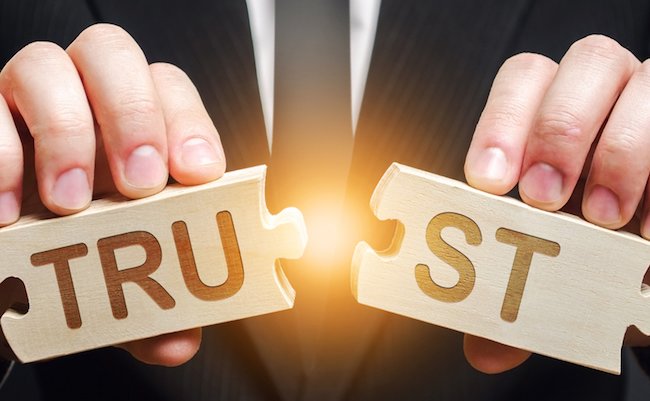 A man shares two puzzles with the word Trust. Violation of agreements and promises. Lose credibility. Failed to maintain professional reputation. Lie and cheat. Bad consequences. Not trustworthy