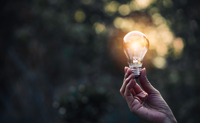 Innovation,And,Energy,Concept,Of,Hand,Hold,A,Light,Bulb