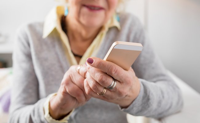 Senior woman holding smartphone