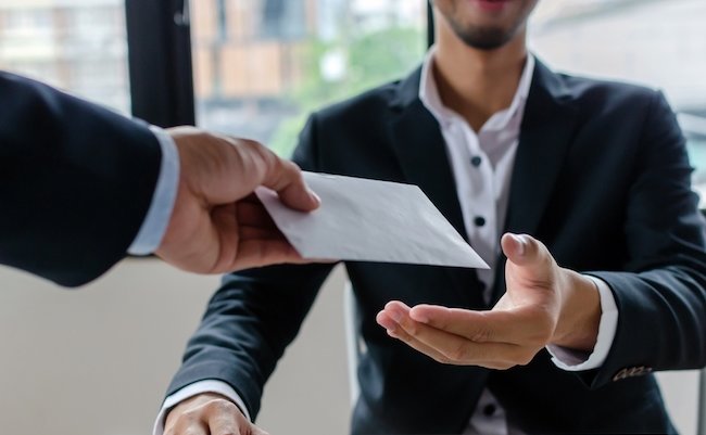 Bonus. boss giving money bonus in paper envelope to business man worker employee for increasing of salary or promotion new position in meeting room office, unemployment, business company concept