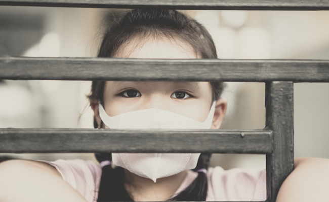 Coronavirus Covid-19.Stay at home Stay safe concept.Little chinese girl wearing mask for protect.Social distancing isolation for stop coronavirus.Coronavirus pandemic virus symptoms.Home school kid.