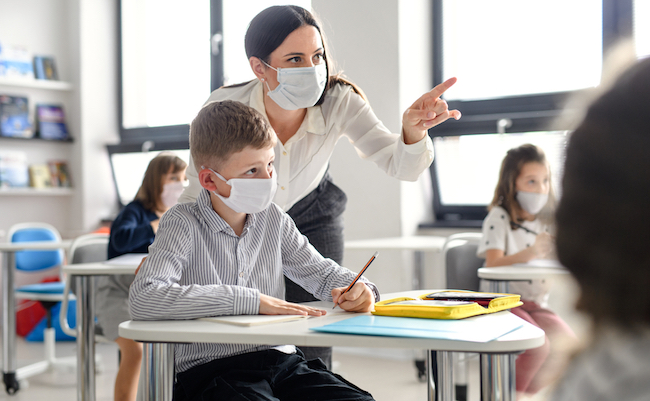 Teacher,And,Children,With,Face,Mask,Back,At,School,After
