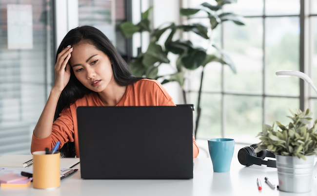 Asian,Woman,Get,Stress,About,Project,In,Front,Of,Laptop