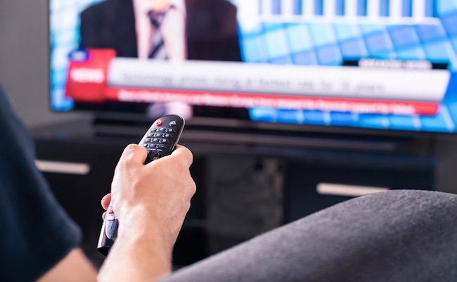 Breaking,News,On,Tv.,Man,Watching,Live,Television,Broadcast,Program.