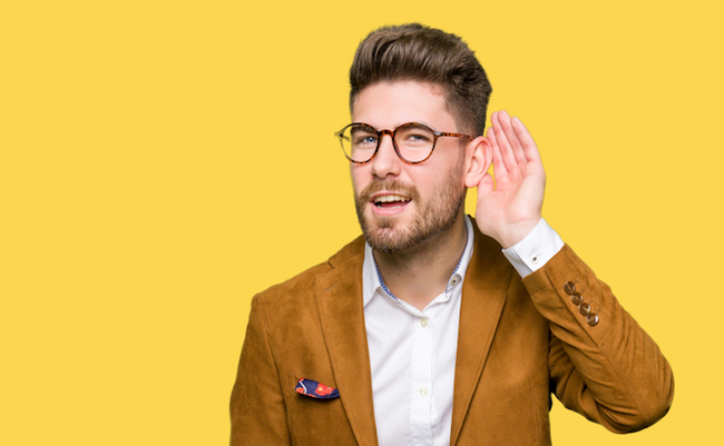 Young,Handsome,Business,Man,Wearing,Glasses,Smiling,With,Hand,Over