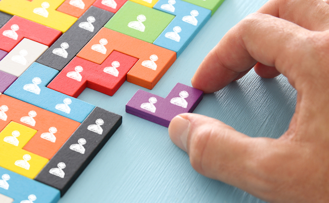 Image,Of,Tangram,Puzzle,Blocks,With,People,Icons,Over,Wooden