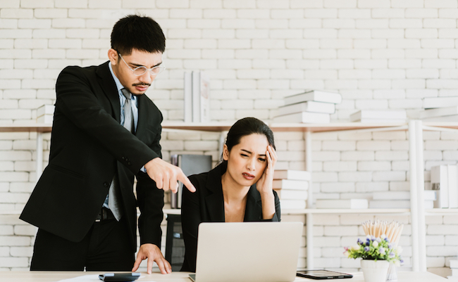 Boss giving order or firing employee. Powerful business man pointing laptop with finger.Angry executive or manager. Tough leadership, strict discipline, workplace bullying or fight at work.