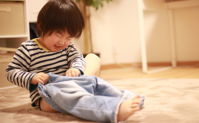 Image of a boy changing clothes