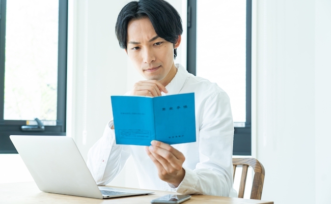 Japanese,Man,With,A,Pension,Book