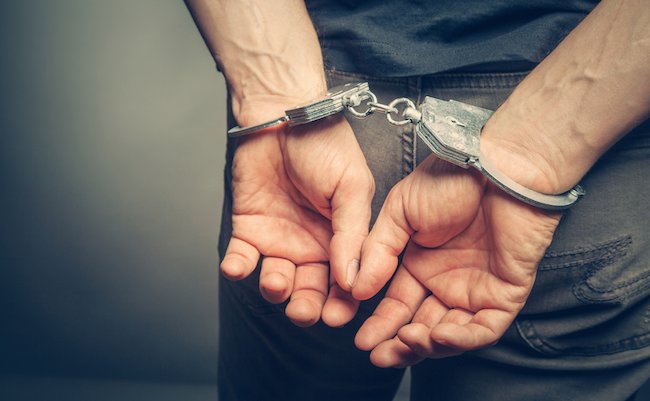 male hands in handcuffs