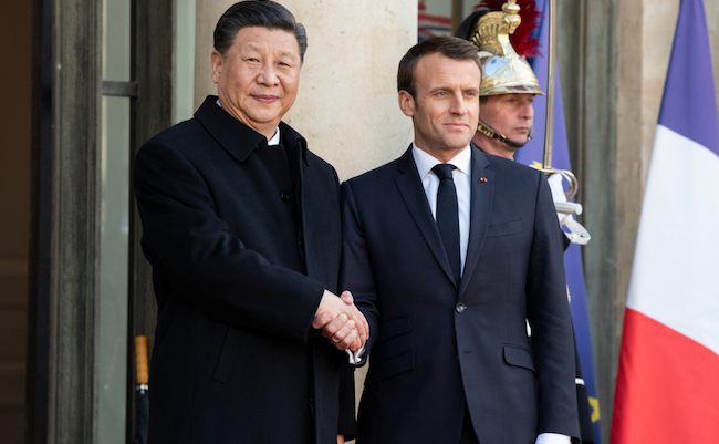 PARIS, FRANCE - MARCH 25, 2018 : The french president Emmanuel Macron welcoming chinese President Xi Jinping during his state visit in France at the Elysee Palace.