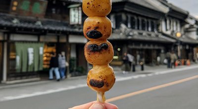 Dango is a classic Japanese street food. The dumplings are made from rice flour dough, grilled and topped with sauce or bean paste. Taken in the historic town of Little Edo, Kawagoe, Saitama, Japan.